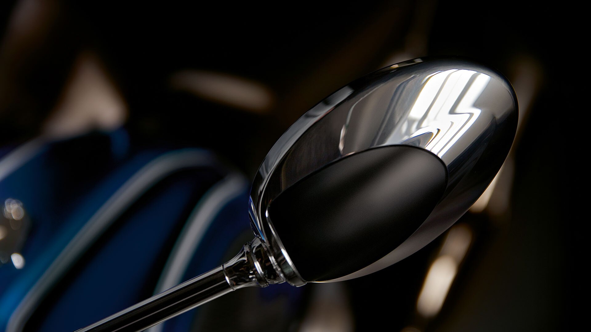 Chrome-plated mirror in typical oval shape.